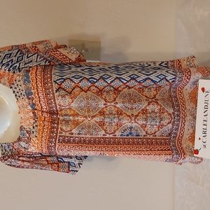 Como Blu blouse. Size M. Short loose flutter sleeves. Pre-owned, good condition.